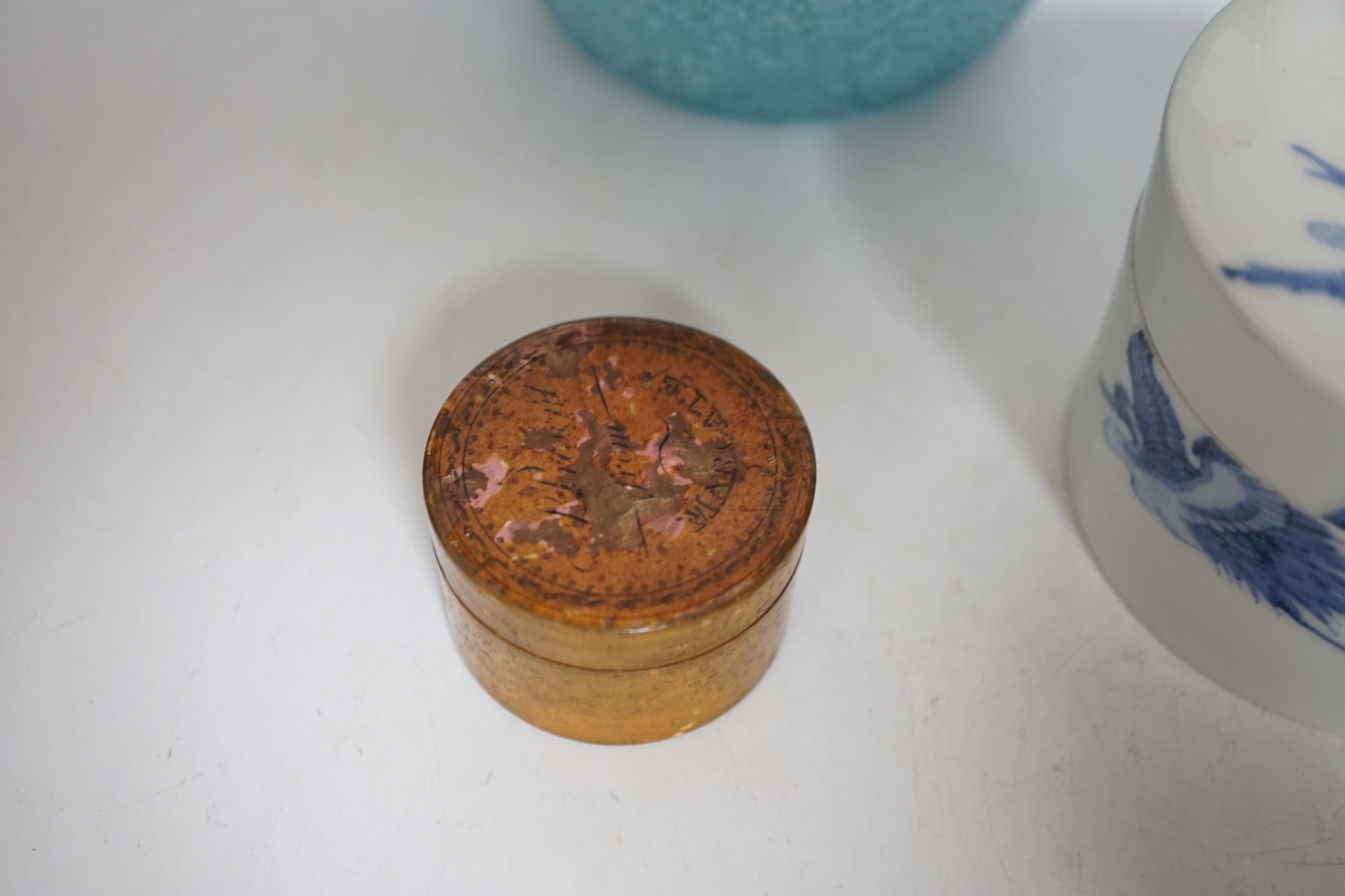 A 19th century Japanese Hirado blue and white cylindrical box and cover, height 8cms, a gold classically decorated glass bottle and a frosted glass jug and wooden pot (4)